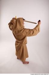 JOEL_ADAMSON WITH CRUCIFIX AND SWORD